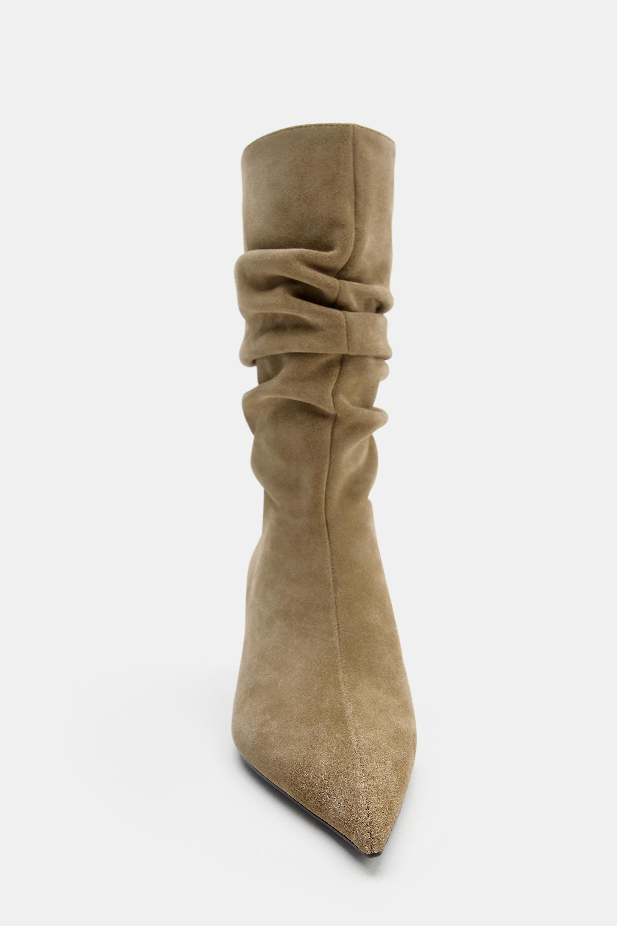 BOTTINES À TALONS COMPENSÉS EN CROÛTE DE CUIR
